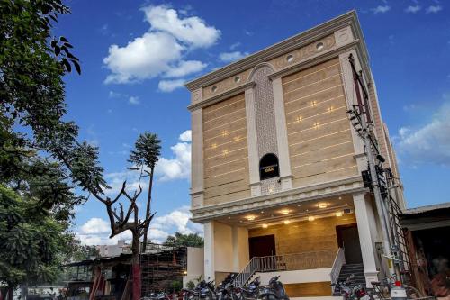 a building with a bunch of bikes parked in front of it at Townhouse OAK Aurelia Grand in Lucknow