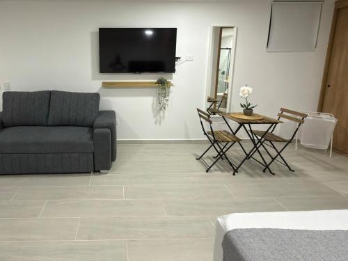 Posezení v ubytování Nuevo apartamento en plaza principal de Guatape