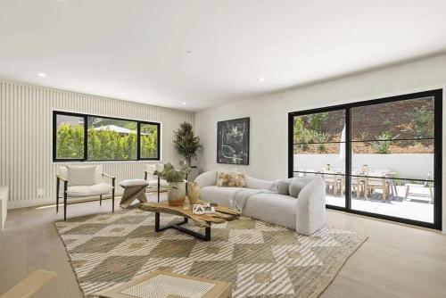 a living room with a couch and a table at The Dona Modern in Los Angeles