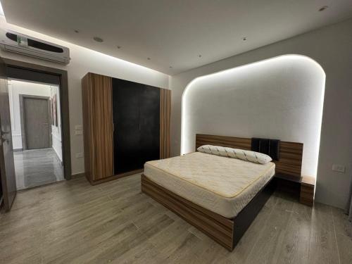 a bedroom with a bed in a room at EMPIRE-K Homes -Khalid's Villa in New cairo