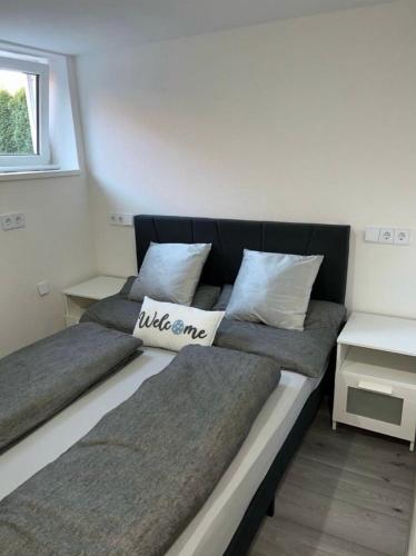 two beds sitting next to each other in a room at Apartment in Bisingen