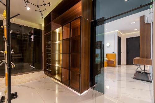 a room with a large glass display case at Luxury 3 bedroom penthouse with 2 living room in Lekki