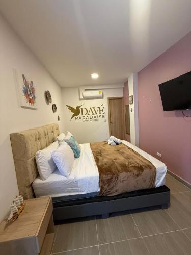 Una cama o camas en una habitación de Davé Paradise