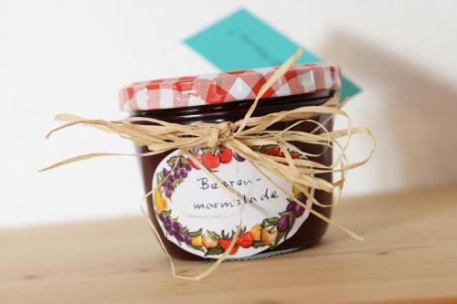 a jar of jam sitting on top of a table at Ferienwohnung Zum Bäckersepp in Neuschönau