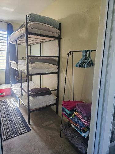 a room with four bunk beds in a room at Casa Verde in Naguabo