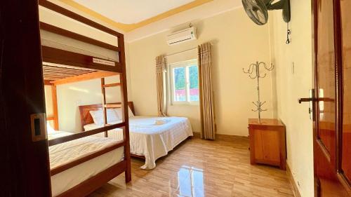 Postel nebo postele na pokoji v ubytování Hotel CÔ CÚC