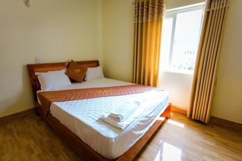 Postel nebo postele na pokoji v ubytování Hotel CÔ CÚC
