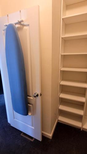 a door to a closet with a blue lid at Cozy SFH for Active Adults in Middletown