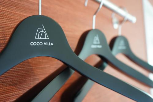 a close up of a rack of gooco villas signs at COCO VILLA 南房総 Dog Stay in Minamiboso