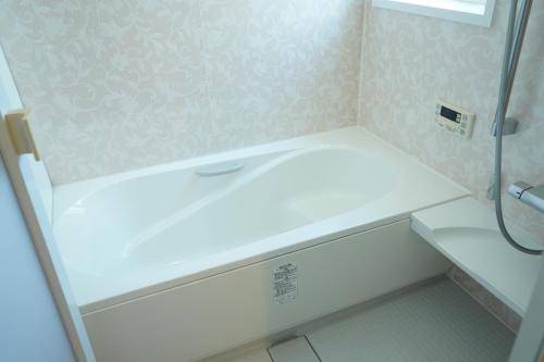 a bathroom with a white sink and a shower at COCO VILLA 南房総 Dog Stay in Minamiboso