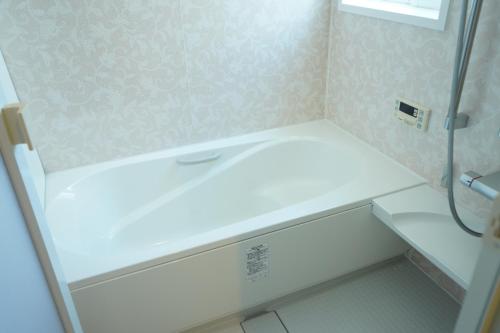a bathroom with a white sink and a shower at COCO VILLA 南房総 Dog Stay in Minamiboso