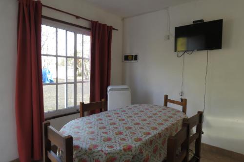 a hospital room with a bed and a window at Casa de Campo LA ALDEA in Campo Quijano