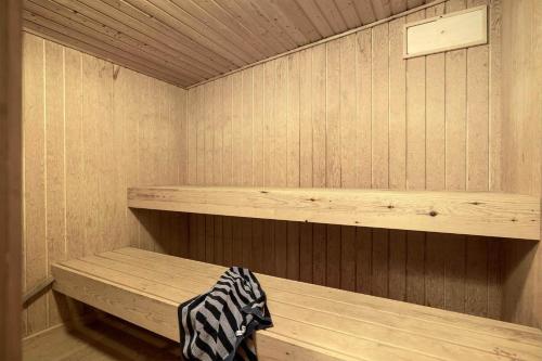 a wooden sauna with a bench in it at TV1595-Skagen-Kaeruldvej-23 in Skagen
