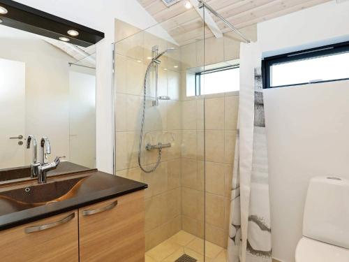 a bathroom with a sink and a shower at Luxury Retreat in Lonstrup - By Traum Ferienwohnungen in Hjørring