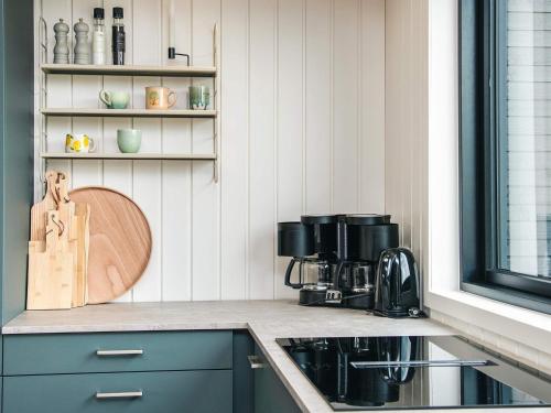 a kitchen with a sink and a counter top at 5 star holiday home in Ansager in Ansager