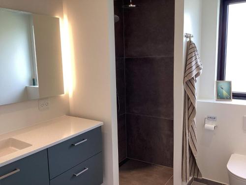 a bathroom with a shower and a sink and a mirror at 5 star holiday home in Ansager in Ansager