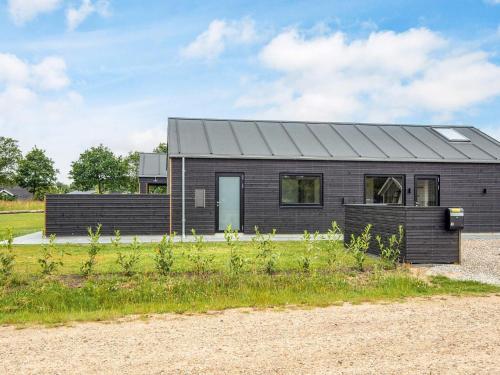 a brick house with a gray roof at 5 star holiday home in Ansager in Ansager