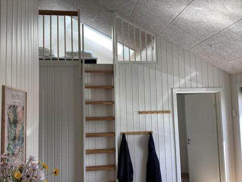 a room with a book shelf on the wall at 5 star holiday home in Ansager in Ansager