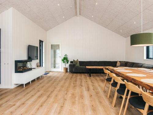 a living room with a table and a couch at 5 star holiday home in Ansager in Ansager