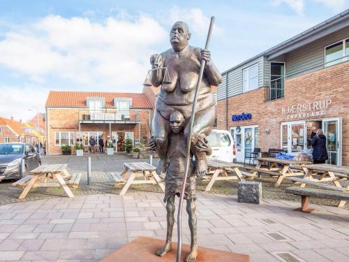 a statue of a man holding a baseball bat at Charming Retreat in Ringkobing in Ringkøbing