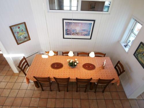 an overhead view of a dining room table and chairs at 10 person holiday home in Tisvildeleje in Tisvildeleje