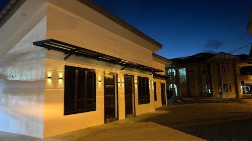 a building with lights on the side of it at D'villa roomstay tangkak in Tangkak