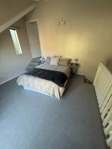 a bedroom with a large bed in a room at Fernhill Retreat in Queenstown