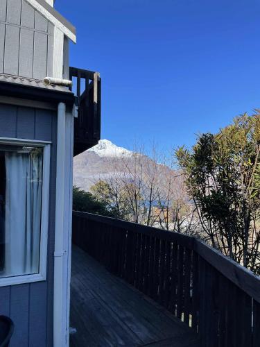 a balcony of a house with a view of a mountain at Fernhill Retreat in Queenstown