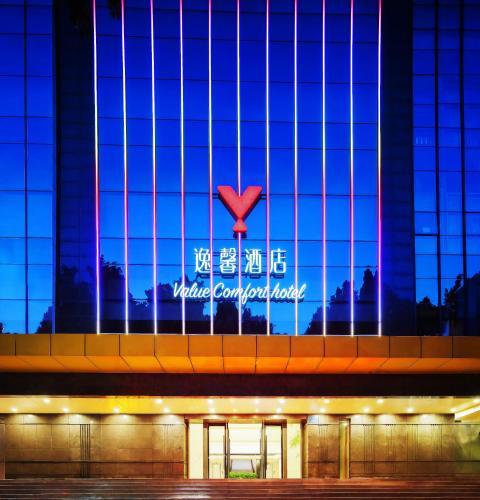 a building with a sign that reads united covenant hotel at Value Comfort Hotel Guangzhou in Guangzhou