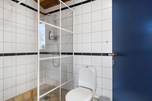a bathroom with a toilet and a shower at TV1656-Skagen-Vandvaerksvej-16 in Skagen