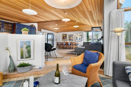 a living room with a table and chairs at TV1656-Skagen-Vandvaerksvej-16 in Skagen