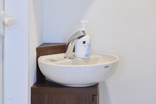 a bathroom sink with a faucet on top of it at 12 とりっぱーずホテル高田馬場 in Tokyo