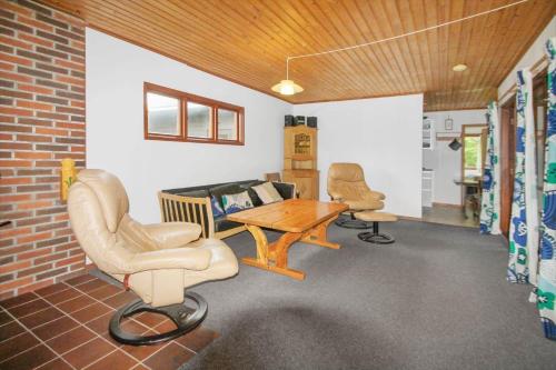 a room with a table and two chairs and a couch at K20061-Gorlev-Eranthisvej-7 in Gørlev