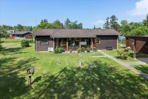 a small house in a yard with a yard at K20061-Gorlev-Eranthisvej-7 in Gørlev