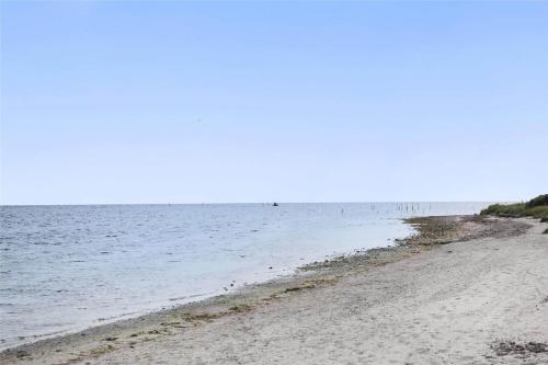 an empty beach with the ocean in the background at SL245-Rude-Fuglevaenget-20 in Rude