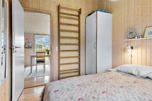 a bedroom with a bed and a room with a table at SL292-Rude-Skovlobervej-2 in Rude