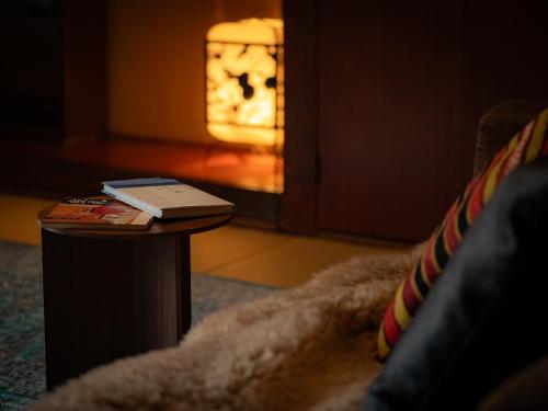 a book sitting on a table in a living room at Okamotoya in Beppu