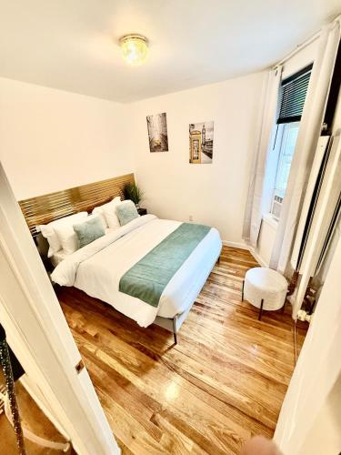 a bedroom with a bed and a staircase at NYCRiverside 2BR Apt 20MintsTime Square in West New York