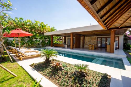 an image of a villa with a swimming pool at Amarta Beach Retreat by Nakula in Tabanan