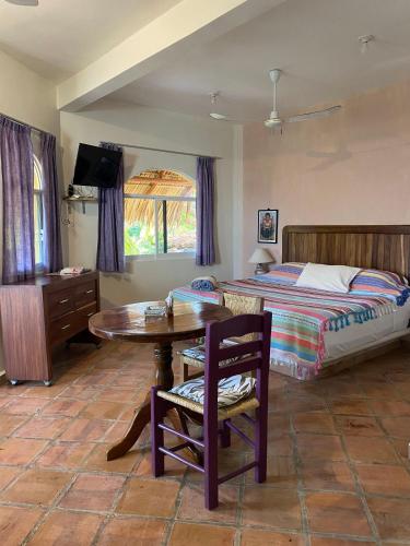 Cama o camas de una habitación en Cielito Lindo Suites