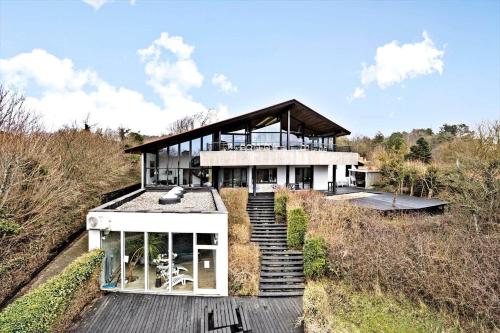 a house on top of a hill with stairs at K19016-Kalundborg-Klintedalsvej-37 in Kalundborg
