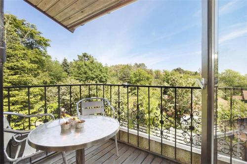 a patio with a table and chairs on a balcony at K19016-Kalundborg-Klintedalsvej-37 in Kalundborg
