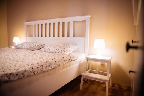 a bedroom with a bed with two pillows on it at Turciansky dvor in Martin
