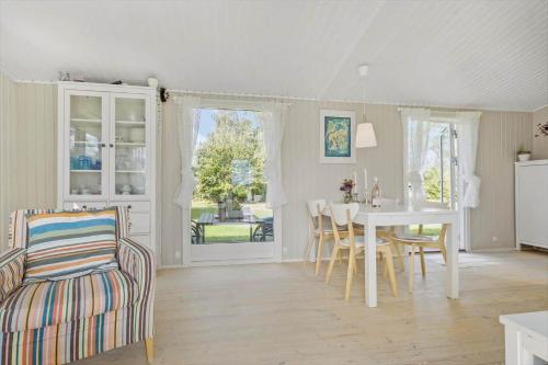 a kitchen and dining room with a table and chairs at K19070-Eskebjerg-Marsvej-3 in Eskebjerg