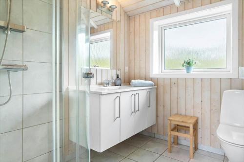 a bathroom with a shower and a sink and a toilet at 20134-Samso-Heden-19 in Nordby