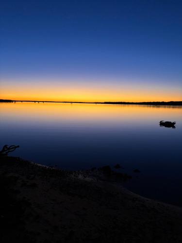 a view of a body of water at sunset at Welcome to BAY 13 in Tin Can Bay