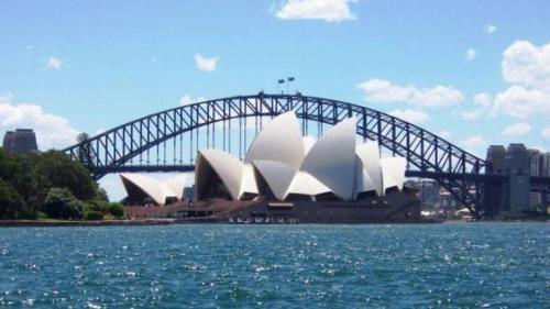 a sydney opera house with a bridge in the background at Cozy Double Room in Glenfield - Centrally Located - Shared Bathroom in Glenfield