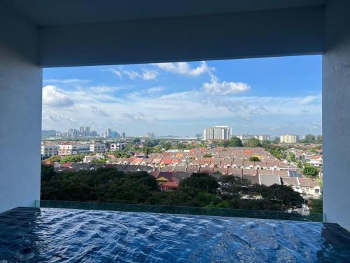 a view of a city from a swimming pool at Edumetro B32 3 Bedroom Subang Sunway By MICASA GROUP in Subang Jaya