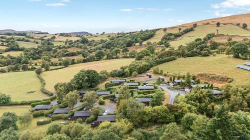 an aerial view of a village in the hills at Valley View in Rhayader