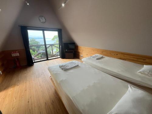Ένα ή περισσότερα κρεβάτια σε δωμάτιο στο LaVilla - Vacation STAY 27602v
